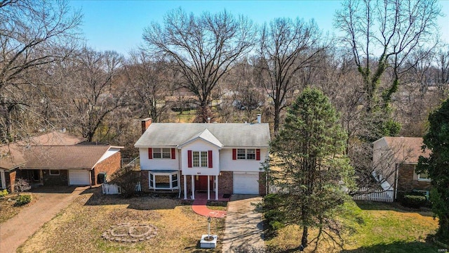 44 Potomac Dr, Fairview Heights, IL 62208 - traditional-style home featuring driveway, brick siding, fence, and a chimney