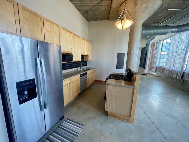 kitchen featuring stainless steel appliances, light brown cabinets, tasteful backsplash, and concrete flooring
