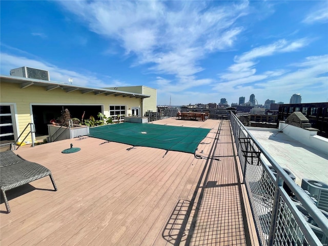 view of swimming pool with a skyline view