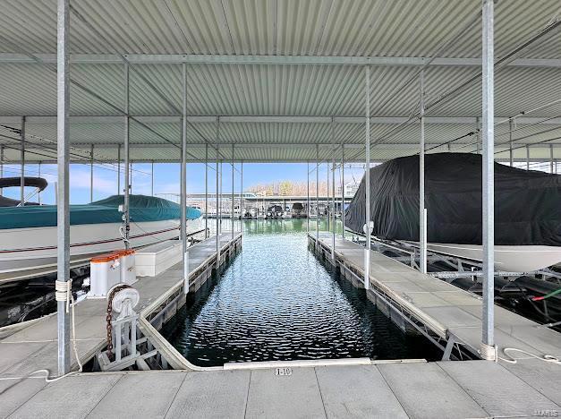 dock area featuring a water view and boat lift