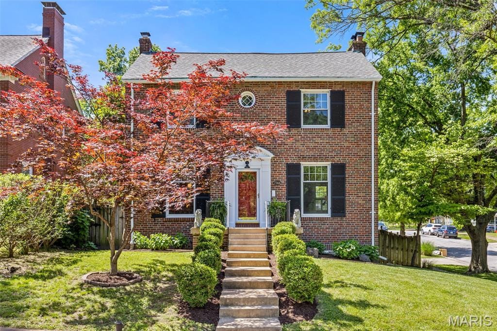 7366 Chamberlain Ave, University City, MO 63130 - view of front of home featuring a chimney and brick siding