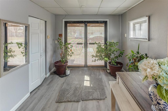 424 N College St, Centralia, IL 62801 - entryway featuring a drop ceiling, wood finished floors, and plenty of natural light
