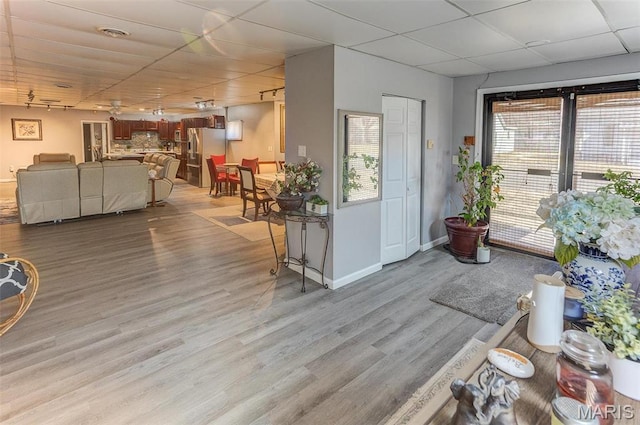 424 N College St, Centralia, IL 62801 - living area featuring a paneled ceiling and light wood-style flooring