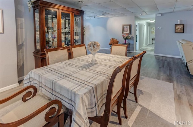424 N College St, Centralia, IL 62801 - dining space with wood finished floors and a paneled ceiling