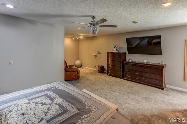 424 N College St, Centralia, IL 62801 - carpeted bedroom with ceiling fan and a textured ceiling