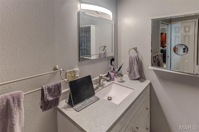 424 N College St, Centralia, IL 62801 - bathroom with vanity and a textured wall