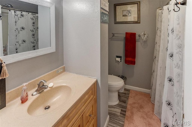 424 N College St, Centralia, IL 62801 - full bath with vanity, wood finished floors, and a shower with curtain