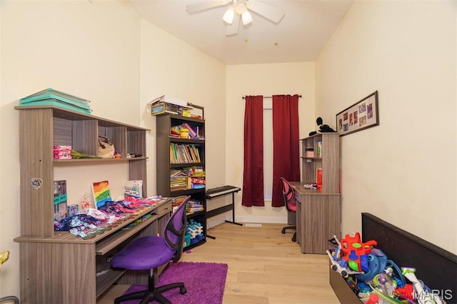office space with wood finished floors and ceiling fan