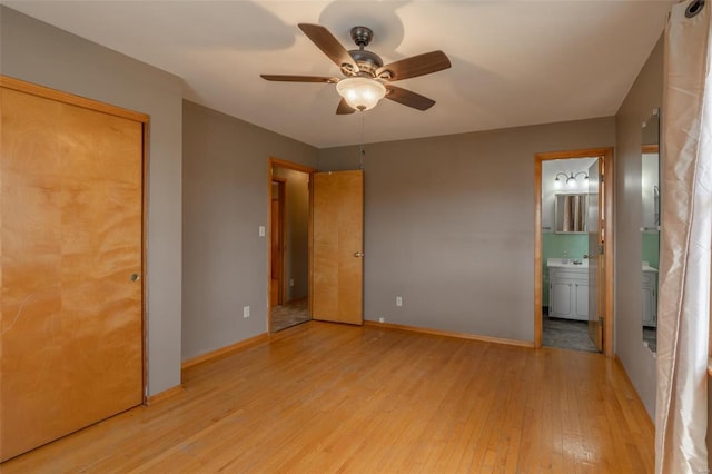 762 Cave Farm Rd, Troy, MO 63379 - unfurnished bedroom featuring light wood finished floors, baseboards, connected bathroom, and ceiling fan