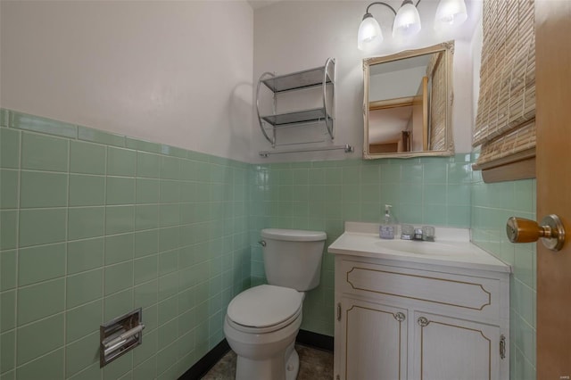 762 Cave Farm Rd, Troy, MO 63379 - bathroom with tile walls, toilet, vanity, and wainscoting