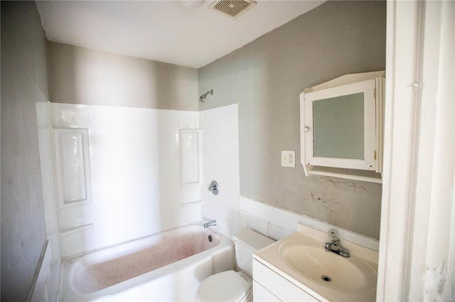 bathroom featuring shower / tub combination, vanity, and toilet