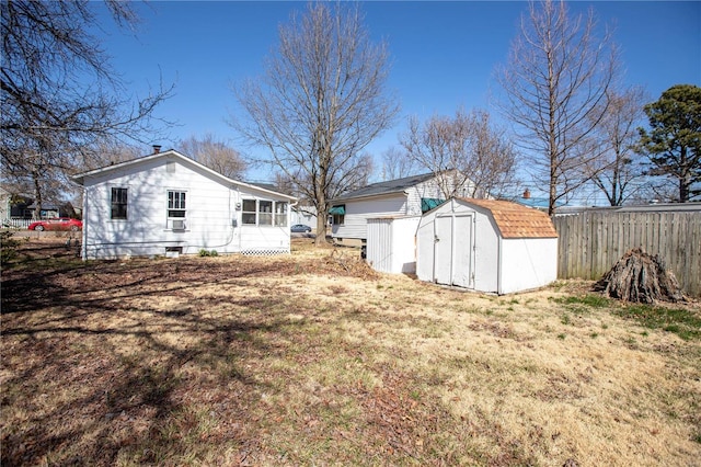 view of yard featuring a storage unit and an outbuilding
