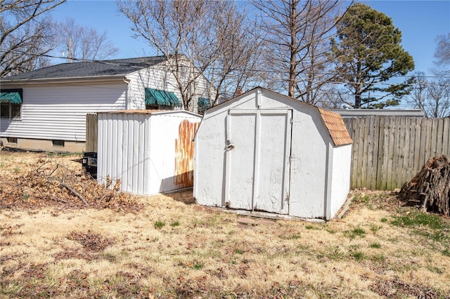 view of shed with fence