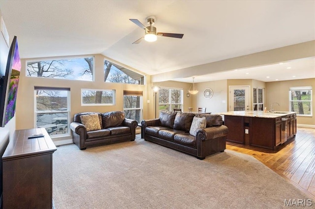 1500 Swiss Village Rd, Osage Beach, MO 65065 - living area featuring ceiling fan, lofted ceiling, light wood-style floors, and light carpet