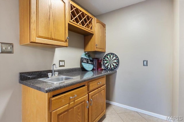 1500 Swiss Village Rd, Osage Beach, MO 65065 - kitchen featuring dark countertops and light tile patterned floors