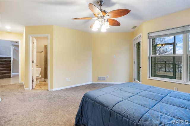 1500 Swiss Village Rd, Osage Beach, MO 65065 - carpeted bedroom with ensuite bath and ceiling fan