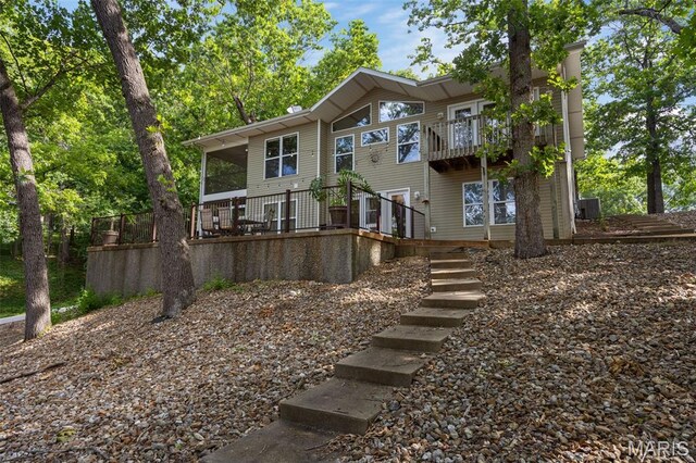 1500 Swiss Village Rd, Osage Beach, MO 65065 - view of front of home with a balcony and stairs