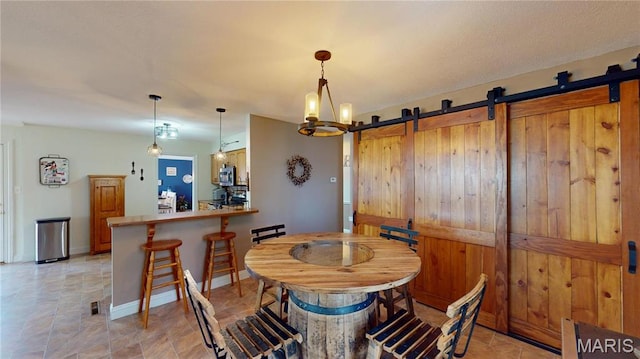 20 Denzel Dr, Greenville, IL 62246 - dining room featuring a barn door and baseboards