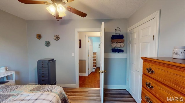20 Denzel Dr, Greenville, IL 62246 - bedroom with dark wood-type flooring, baseboards, a closet, and ceiling fan