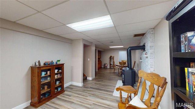 20 Denzel Dr, Greenville, IL 62246 - sitting room with a wood stove, a drop ceiling, wood finished floors, and baseboards