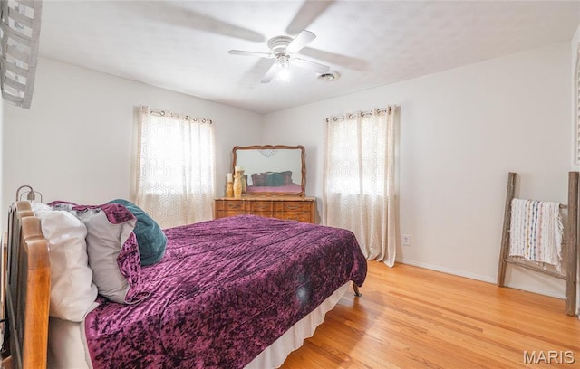 24265 Vinyard Rd, Cuba, MO 65453 - bedroom featuring light wood-style flooring, baseboards, and a ceiling fan