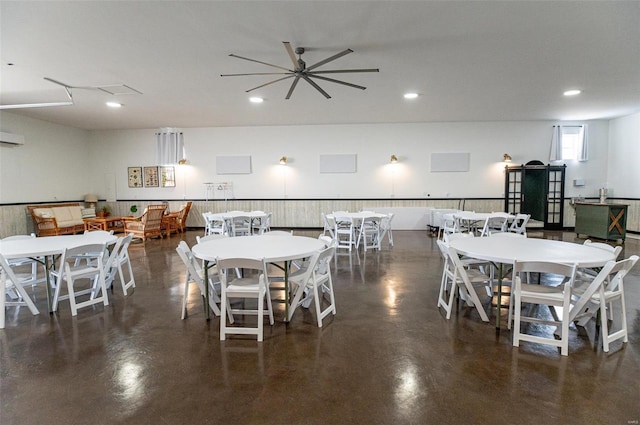 dining area with concrete flooring, recessed lighting, an AC wall unit, and a ceiling fan