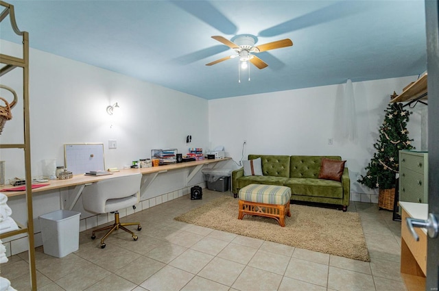 home office with ceiling fan and tile patterned flooring