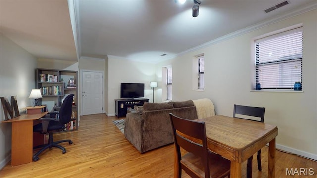 5653 Waterman Blvd Unit 1N, Saint Louis, MO 63112 - dining space with ornamental molding, light wood-type flooring, a desk, and baseboards