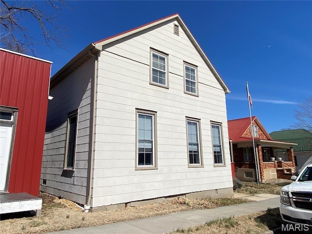 209 E 3rd St, Hermann, MO 65041 - view of side of property with crawl space