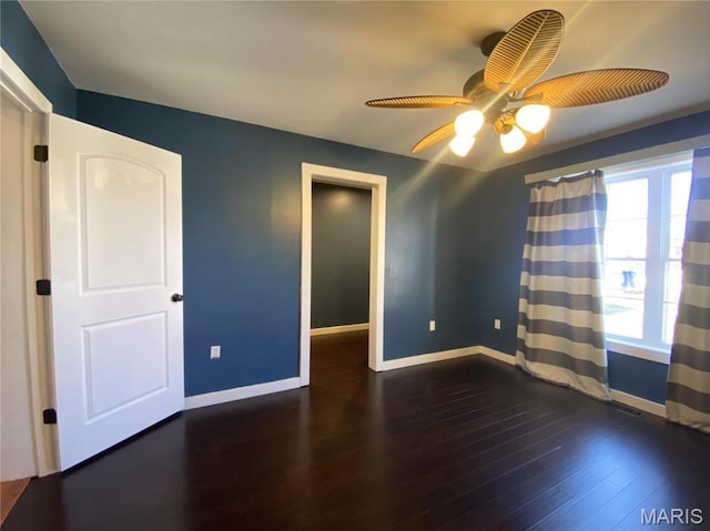 209 E 3rd St, Hermann, MO 65041 - spare room featuring baseboards, hardwood / wood-style flooring, and ceiling fan