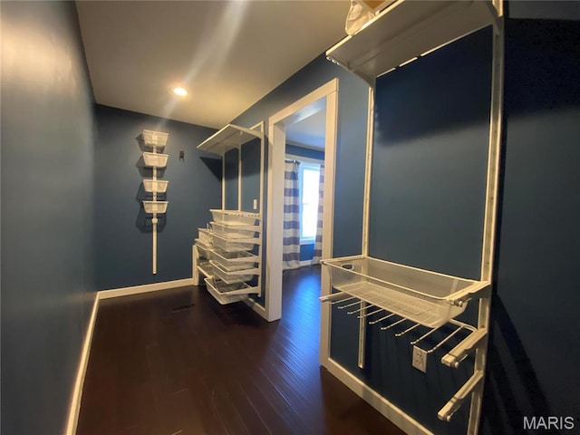 209 E 3rd St, Hermann, MO 65041 - corridor featuring wood finished floors, baseboards, and recessed lighting