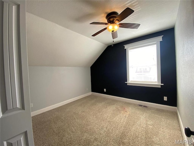 209 E 3rd St, Hermann, MO 65041 - bonus room featuring carpet floors, vaulted ceiling, ceiling fan, and baseboards