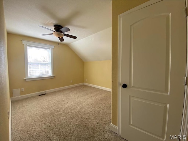 209 E 3rd St, Hermann, MO 65041 - bonus room featuring ceiling fan, carpet floors, lofted ceiling, and baseboards