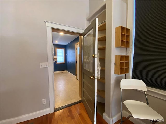 209 E 3rd St, Hermann, MO 65041 - bathroom featuring baseboards and wood finished floors