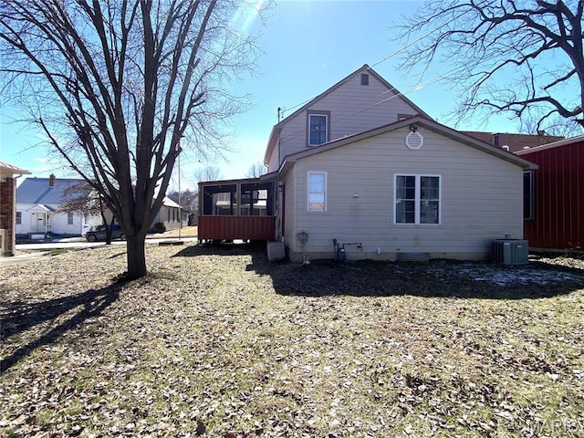 209 E 3rd St, Hermann, MO 65041 - rear view of property with a sunroom and central AC unit