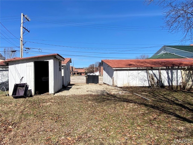 209 E 3rd St, Hermann, MO 65041 - view of yard featuring a storage unit and an outdoor structure