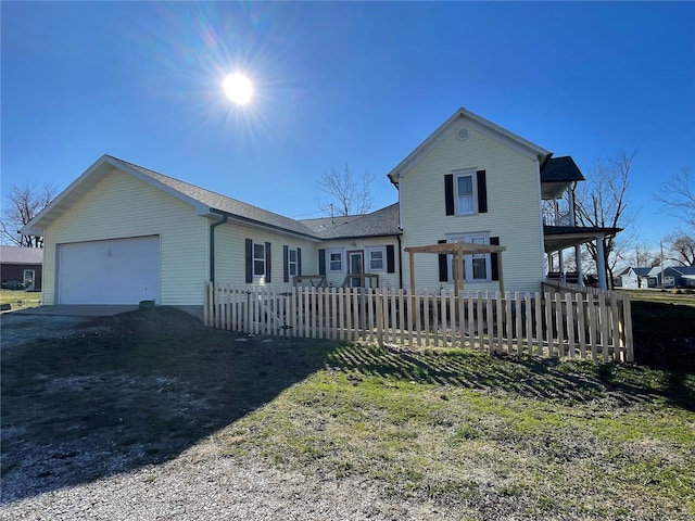 506 E Jefferson St, Perry, MO 63462 - view of front of home featuring dirt driveway, a garage, and a shingled roof