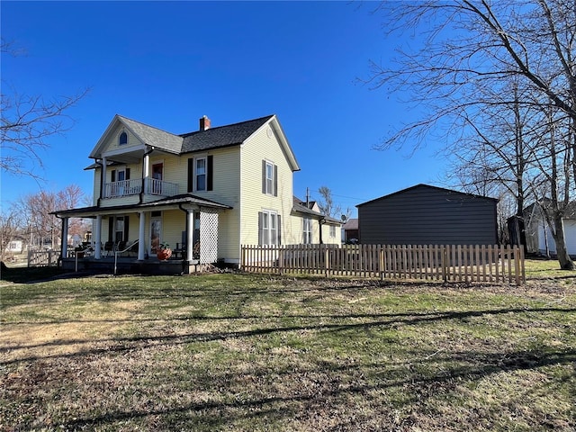 506 E Jefferson St, Perry, MO 63462 - back of house with a balcony, covered porch, a chimney, and a shingled roof