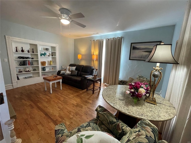 506 E Jefferson St, Perry, MO 63462 - living area with wood finished floors and ceiling fan