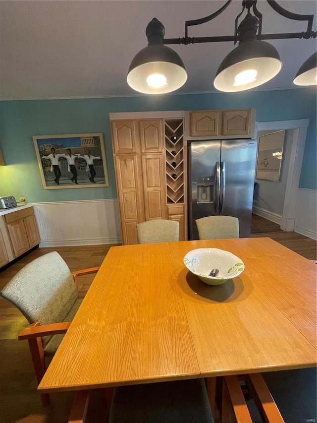 506 E Jefferson St, Perry, MO 63462 - dining area with wood finished floors and a wainscoted wall