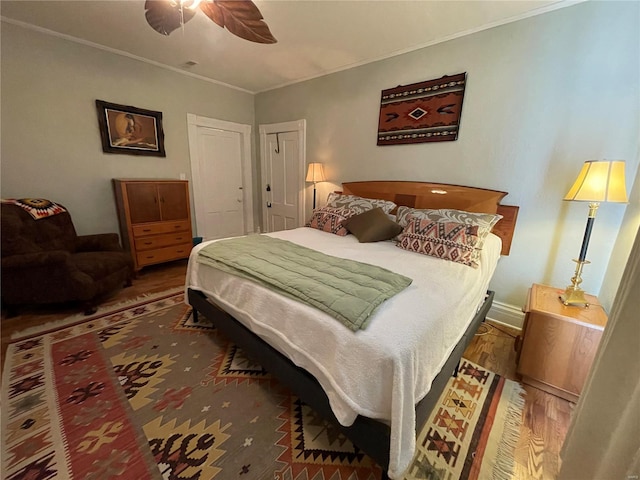 506 E Jefferson St, Perry, MO 63462 - bedroom featuring wood finished floors, ornamental molding, ceiling fan, and baseboards