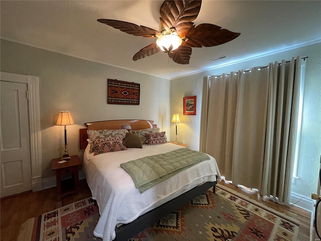 506 E Jefferson St, Perry, MO 63462 - bedroom with wood finished floors, ornamental molding, and a ceiling fan
