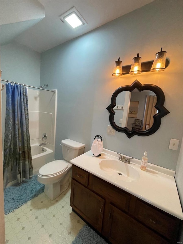 506 E Jefferson St, Perry, MO 63462 - full bathroom with tile patterned floors, toilet, shower / bath combo with shower curtain, and vanity