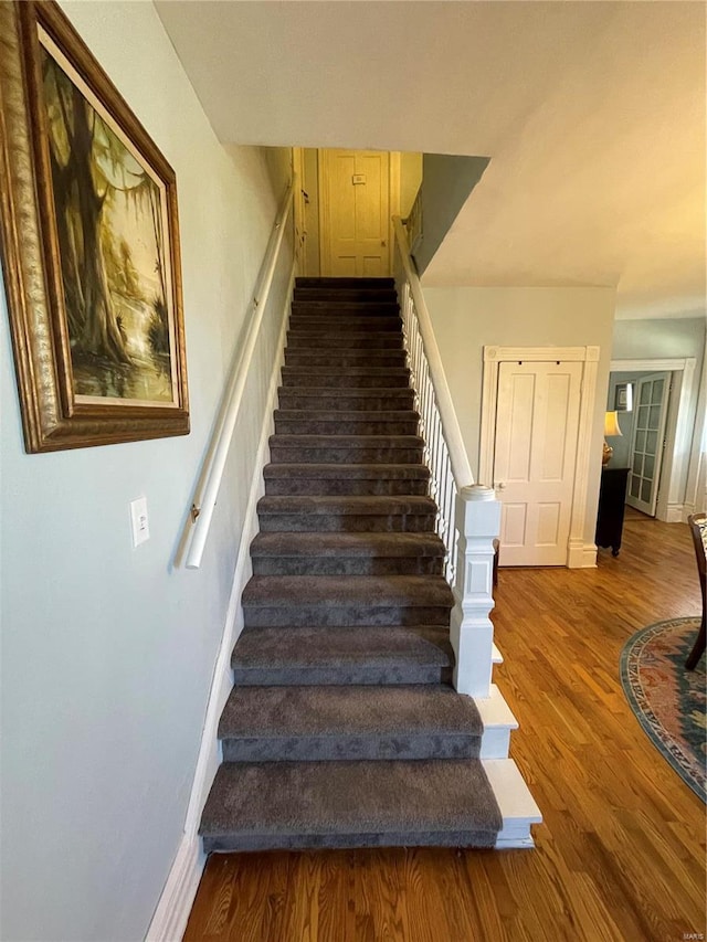 506 E Jefferson St, Perry, MO 63462 - stairway featuring baseboards and wood finished floors