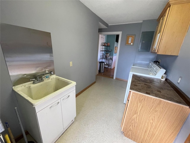506 E Jefferson St, Perry, MO 63462 - kitchen featuring a sink, electric panel, a textured ceiling, and baseboards