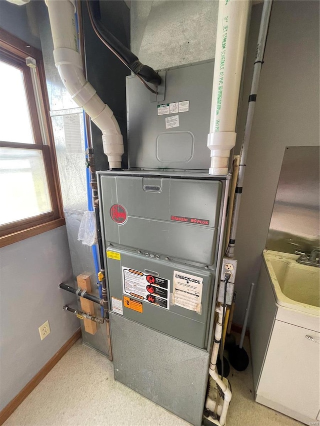 506 E Jefferson St, Perry, MO 63462 - utility room featuring a sink and heating unit