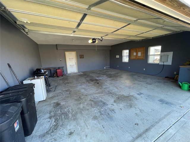 506 E Jefferson St, Perry, MO 63462 - garage featuring a garage door opener