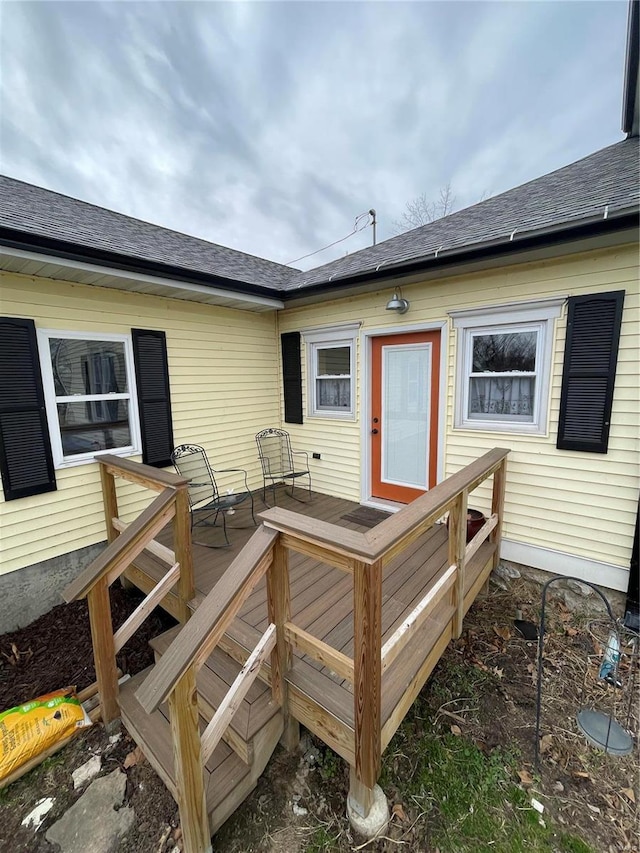 506 E Jefferson St, Perry, MO 63462 - rear view of property featuring a deck and roof with shingles