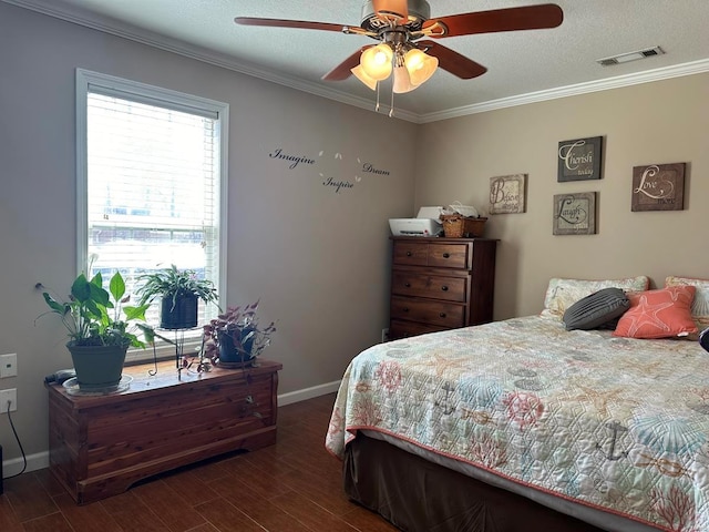 bedroom featuring dark wood-style floors, crown molding, baseboards, and ceiling fan