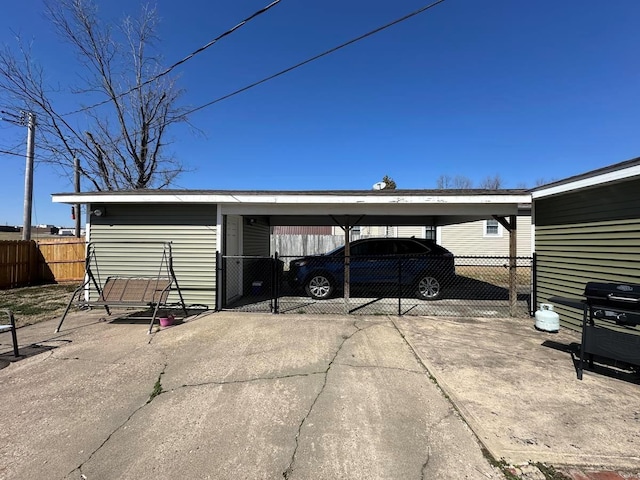 view of parking with fence